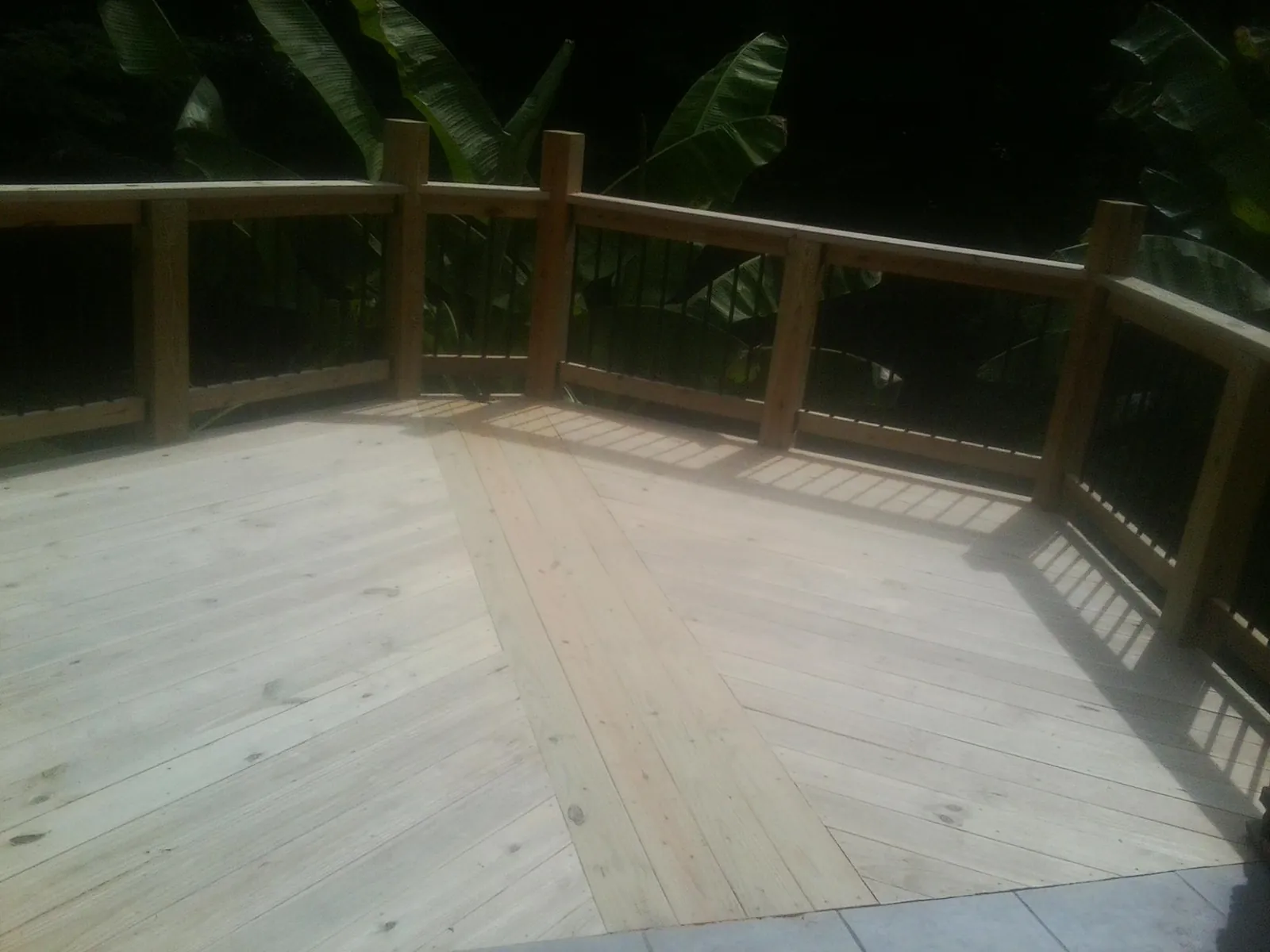 New wood deck and railing built off the back of a home in Shelbyville